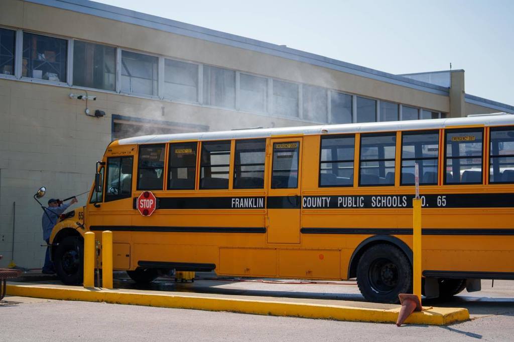 Bus being washed by driver