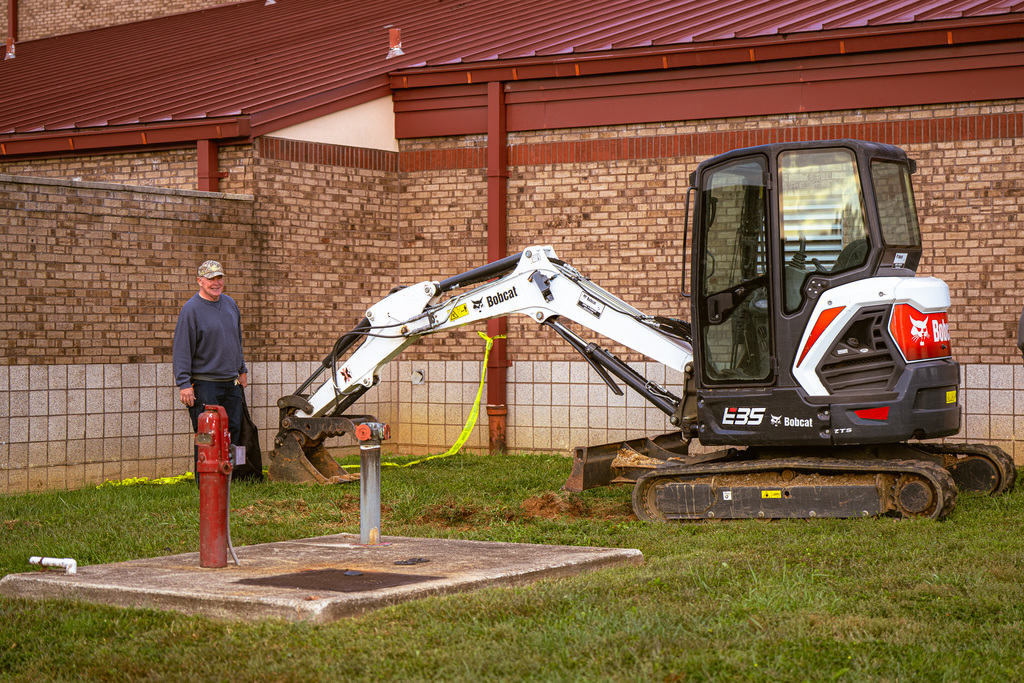 rhodney supervises bobcat work