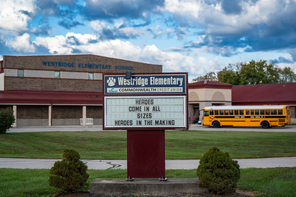 westridge school building and bus sign reads: heroes come in all sizes heroes in the making