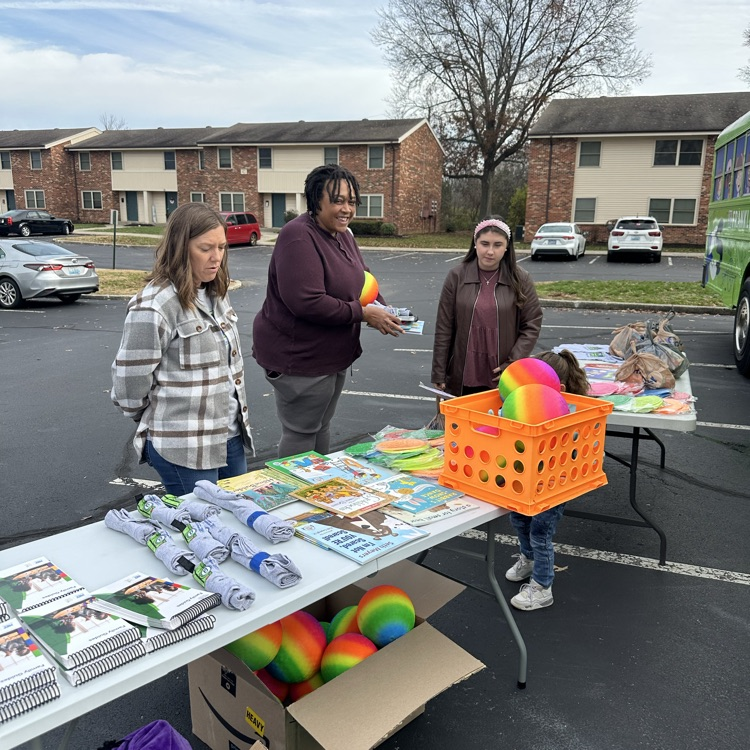 children and families at a table during the event