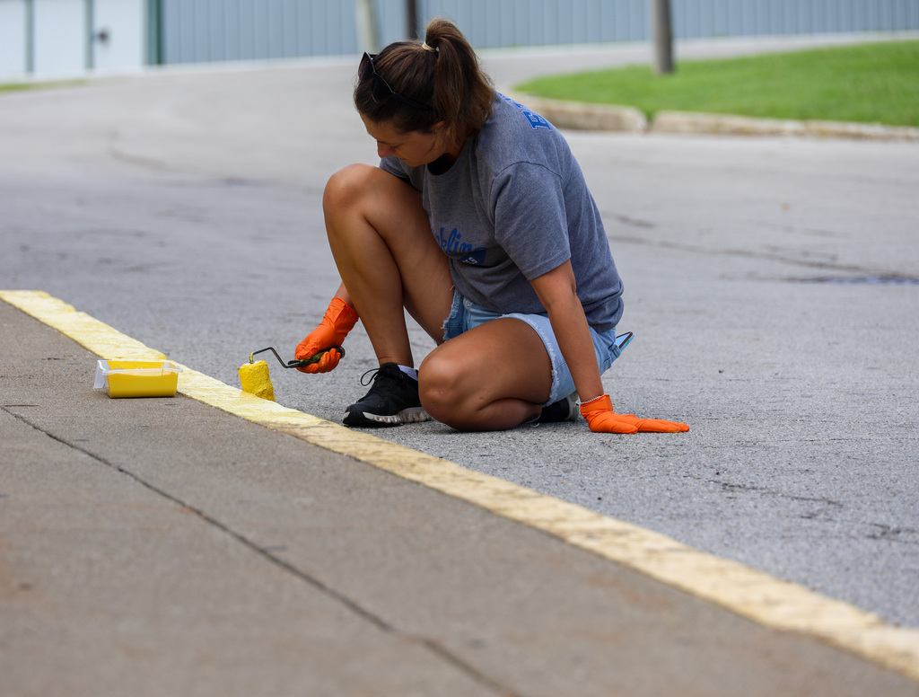Students and staff at Bondurant Middle School teamed up to get the school looking its best.