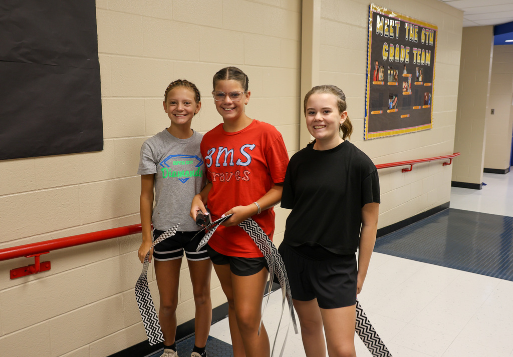 Students and staff at Bondurant Middle School teamed up to get the school looking its best.