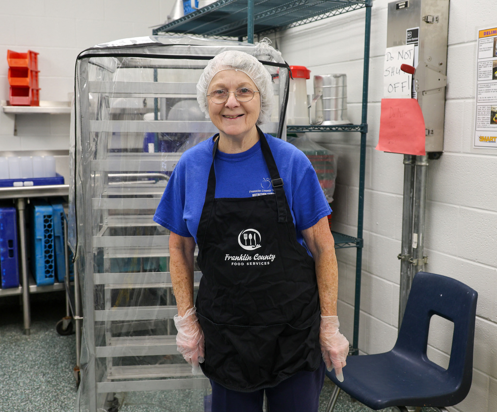 Bridgeport Elementary Food Service staff member stands in the kitchen.