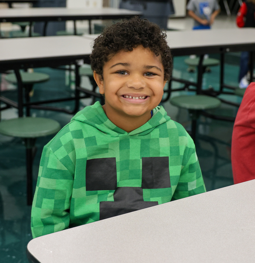 Bridgeport Elementary student smiling at the lunch table.