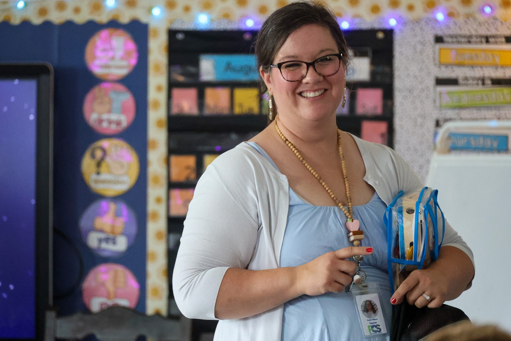 ELV staff member smiles in the classroom.