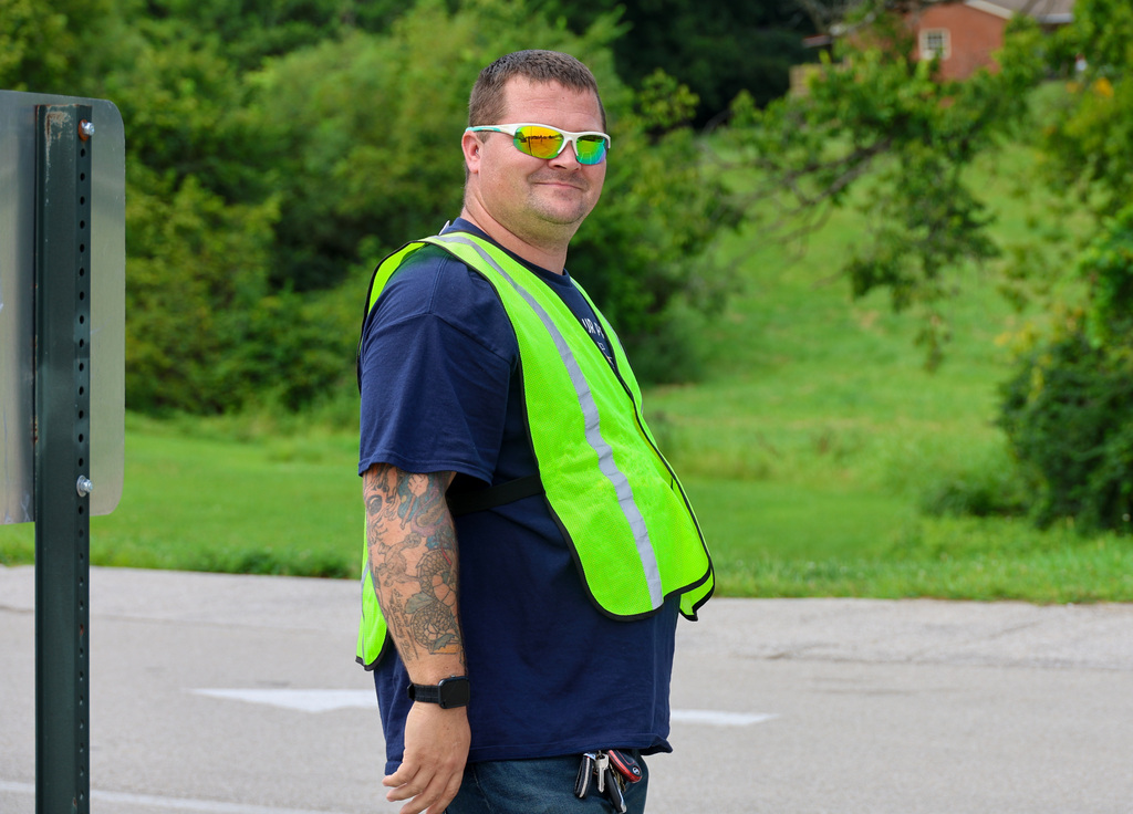 FCS employee smiles as he directs traffic for dismissal at Elkhorn Elementary School.