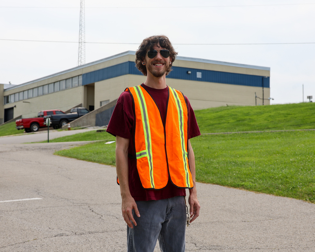 FCS employee smiles as he directs traffic for dismissal at Elkhorn Elementary School.