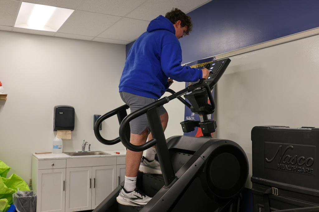 Fire Science student prepares for a PT test on the stair master.