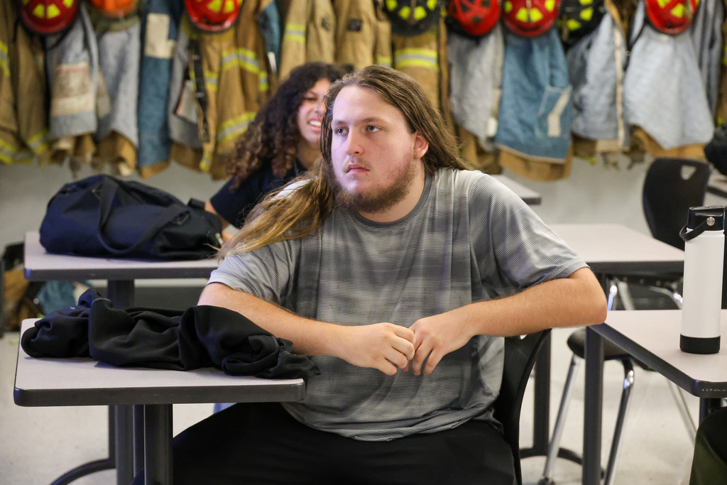 Fire Science student listens in classroom.