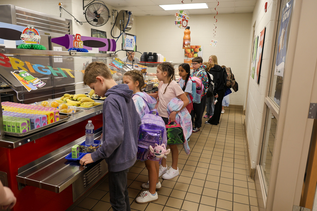 FCS students go through the kitchen line to get food.