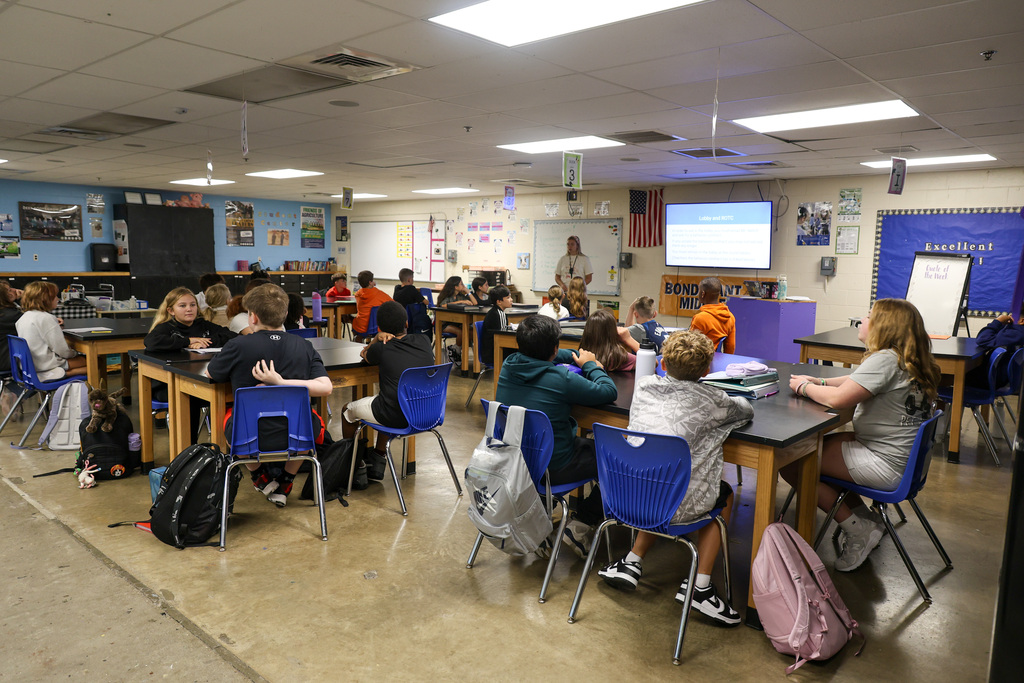 Agriculture classroom with students in their seats and teacher at the front speaking.