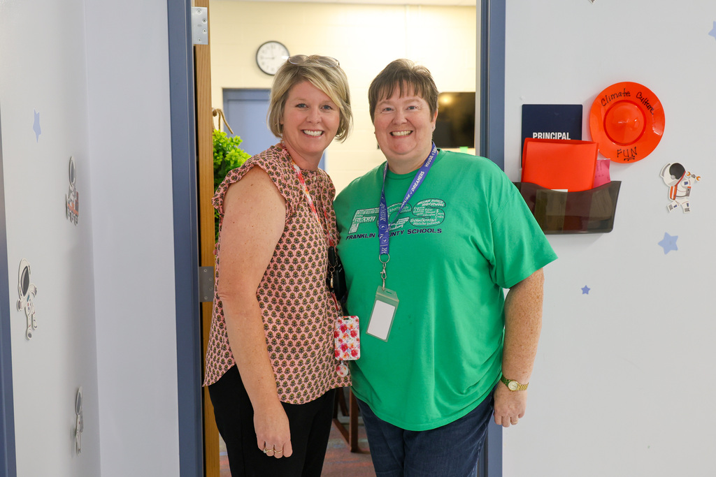 Principal Lynette McKinney (left) stands with board member Jennifer Kantner (right)