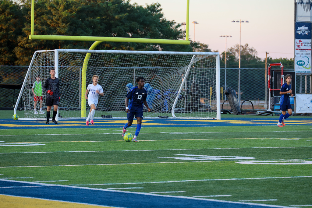 FCHS soccer player kicks the ball during the game.