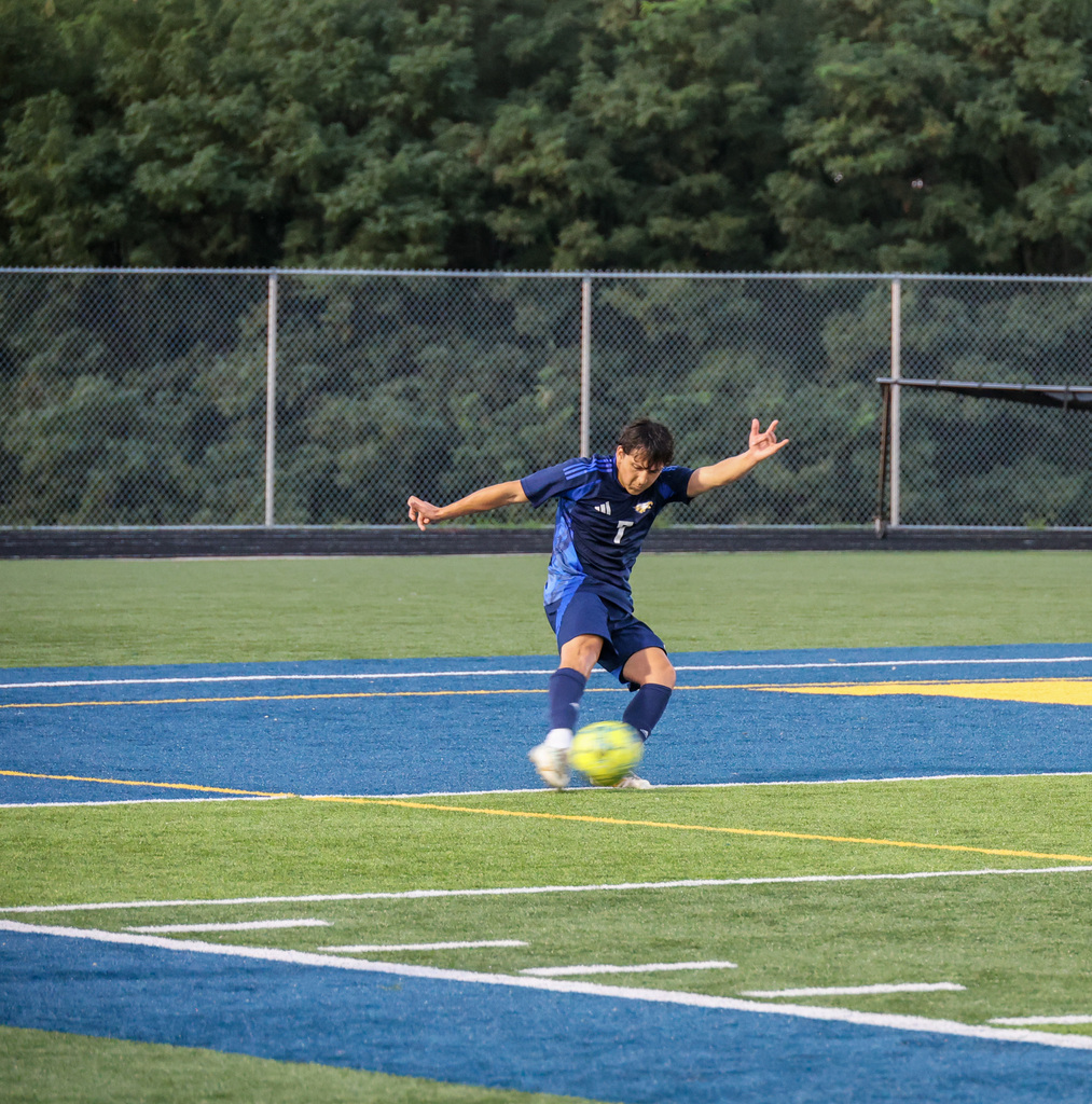 FCHS player kicks the soccer ball.