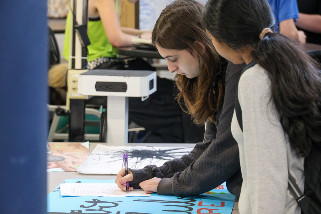 Student signs up for a club.