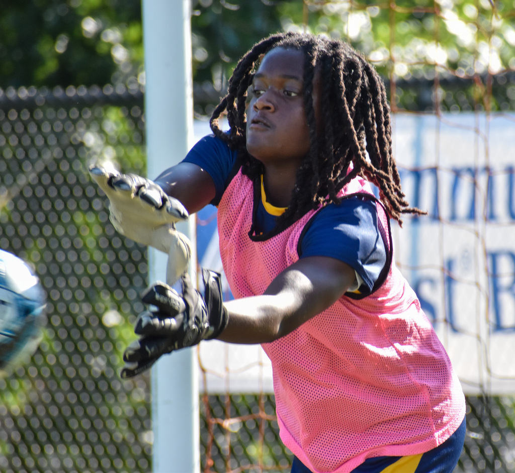 FCHS Goalie blocks the soccer ball.