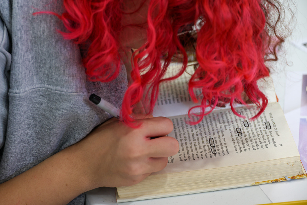 Close up shot of Academy student circling words on a page.