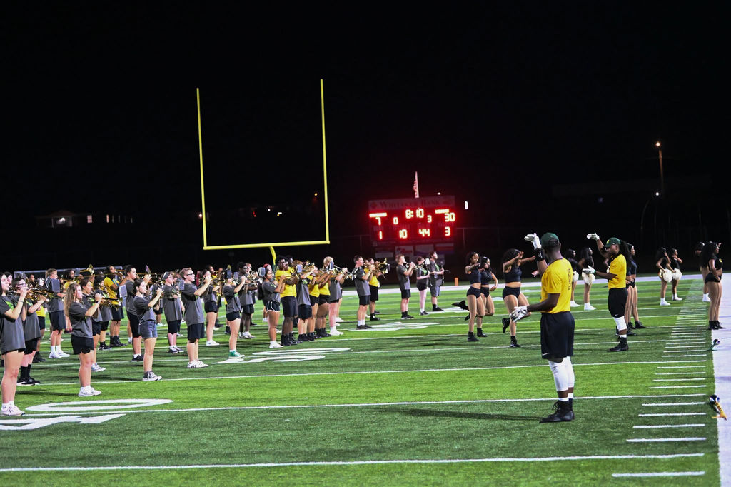 KSU and WHHS bands play on the field.