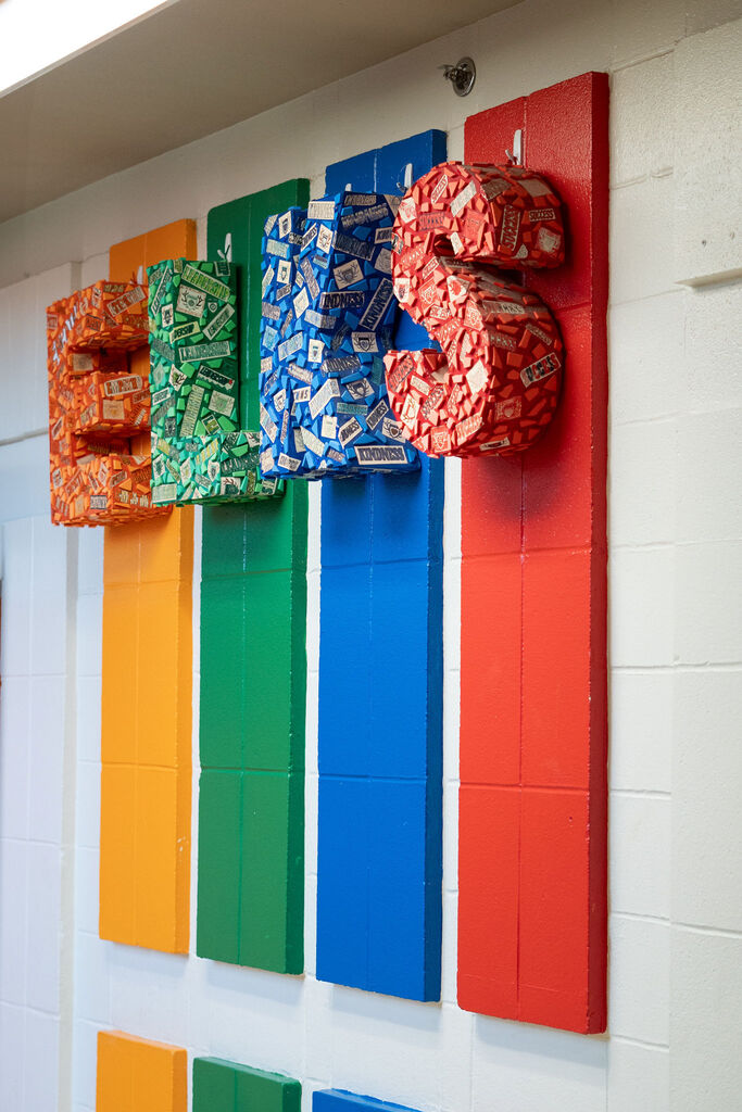 "ELKS" sign and each letter is a different color representing the four herds.