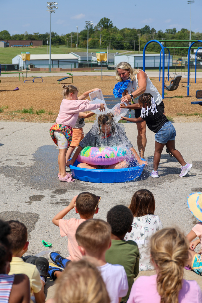 Students dunk water on Principal Beach for High Attendance Day.