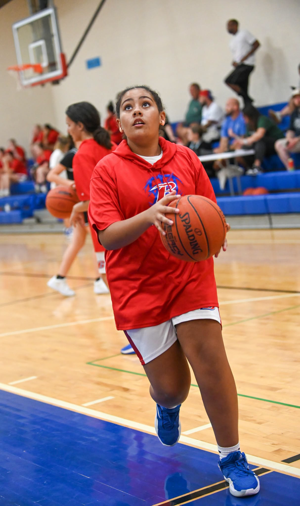 BMS girls basketball player preparing to shoot a layup.