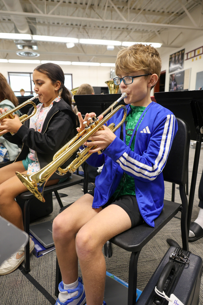 EMS band students playing the trumpet.