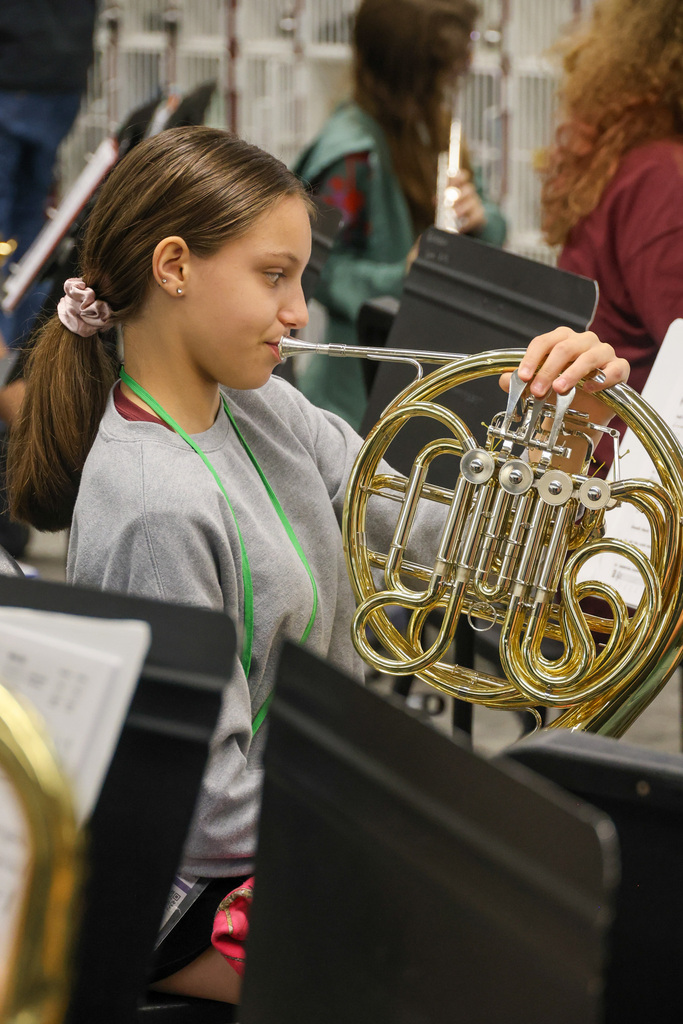 EMS band student playing the french horn.