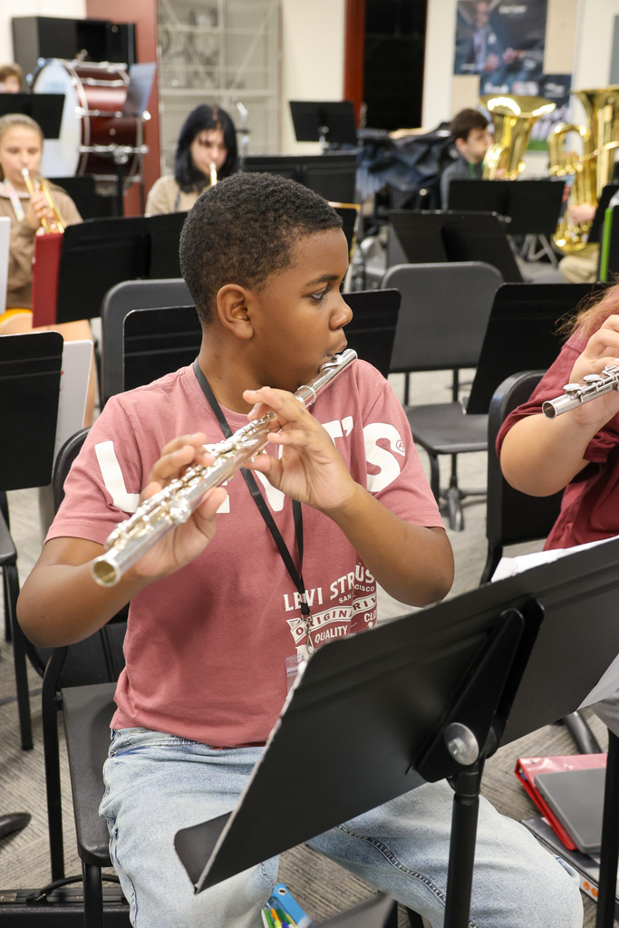 EMS band student playing the flute.