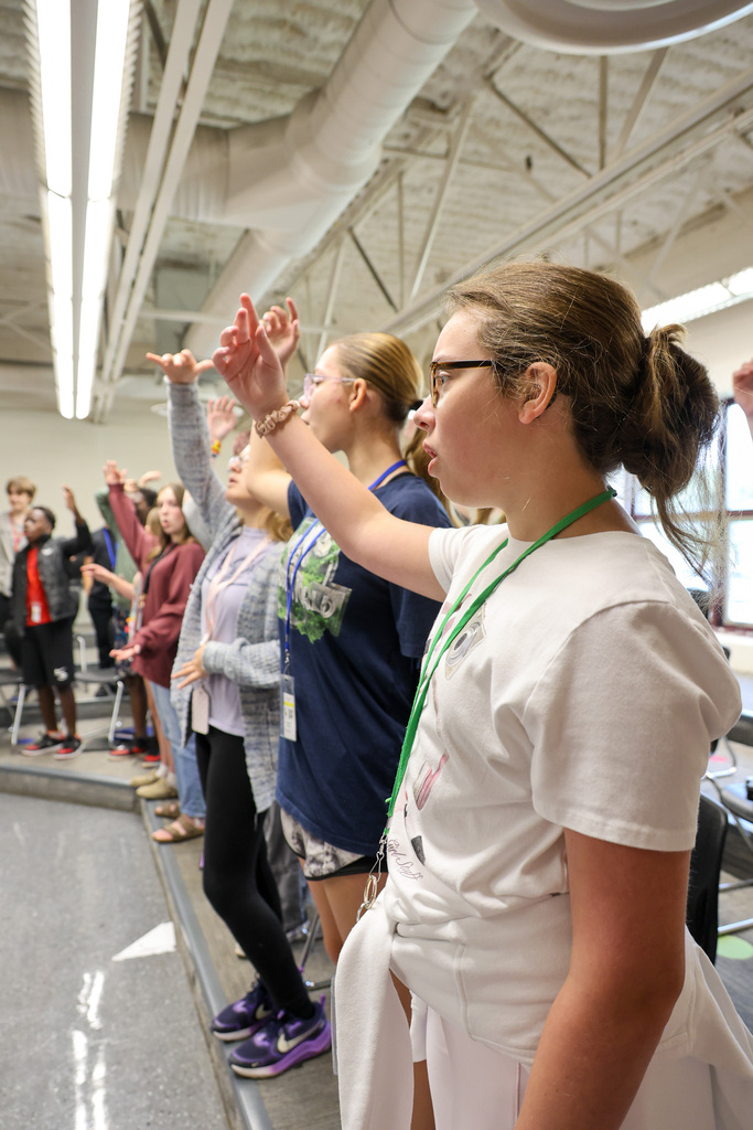 EMS Choir Students standing and singing.