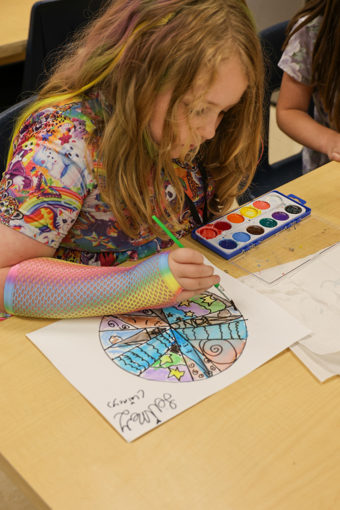 Student paints a dot for "Dot Day"