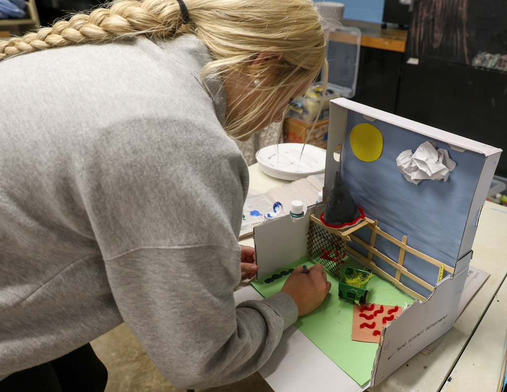 BMS student works on shoe box project.