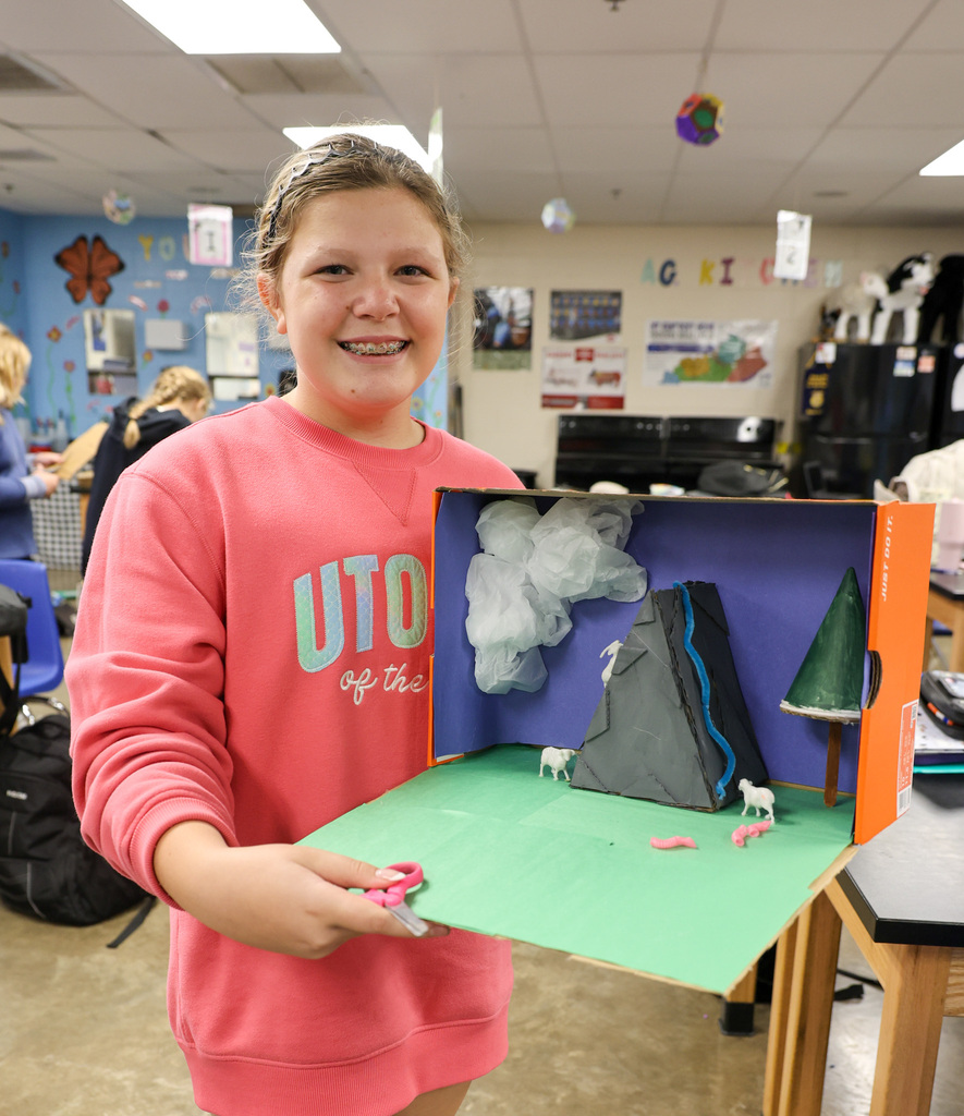 BMS student works on shoe box project.