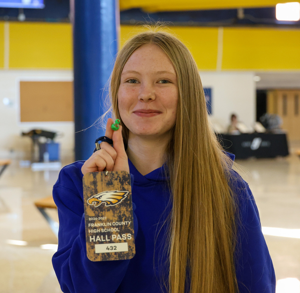 FCHS student holds a tiny green duck that she found for the duck hunt.