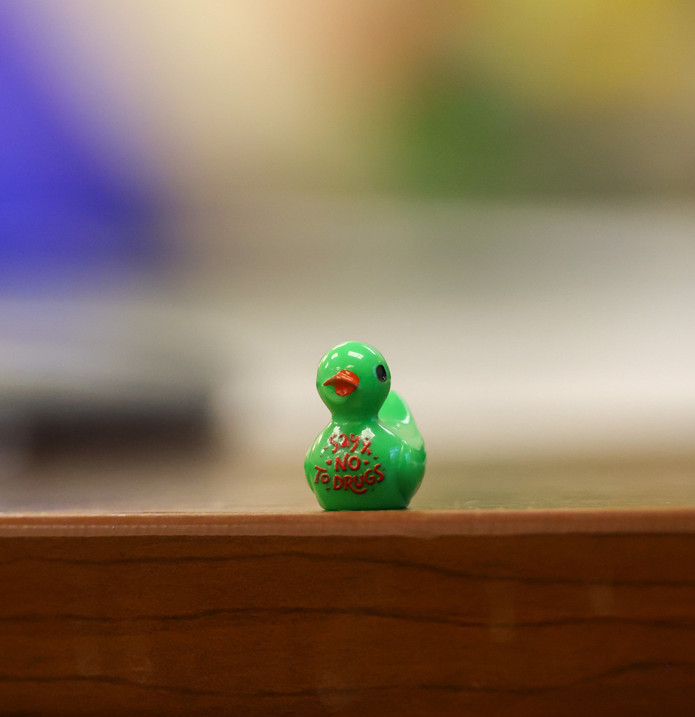 Tiny green duck that says "Say no to drugs"