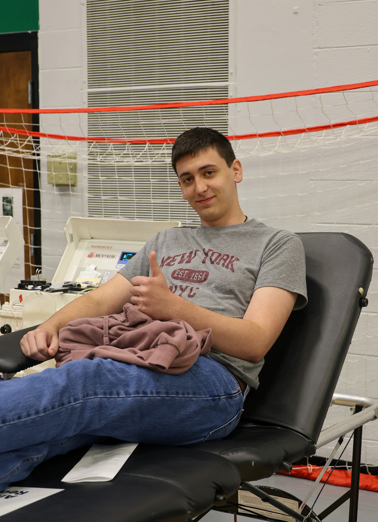 WHHS student gives a thumbs up as he prepares to donate blood.