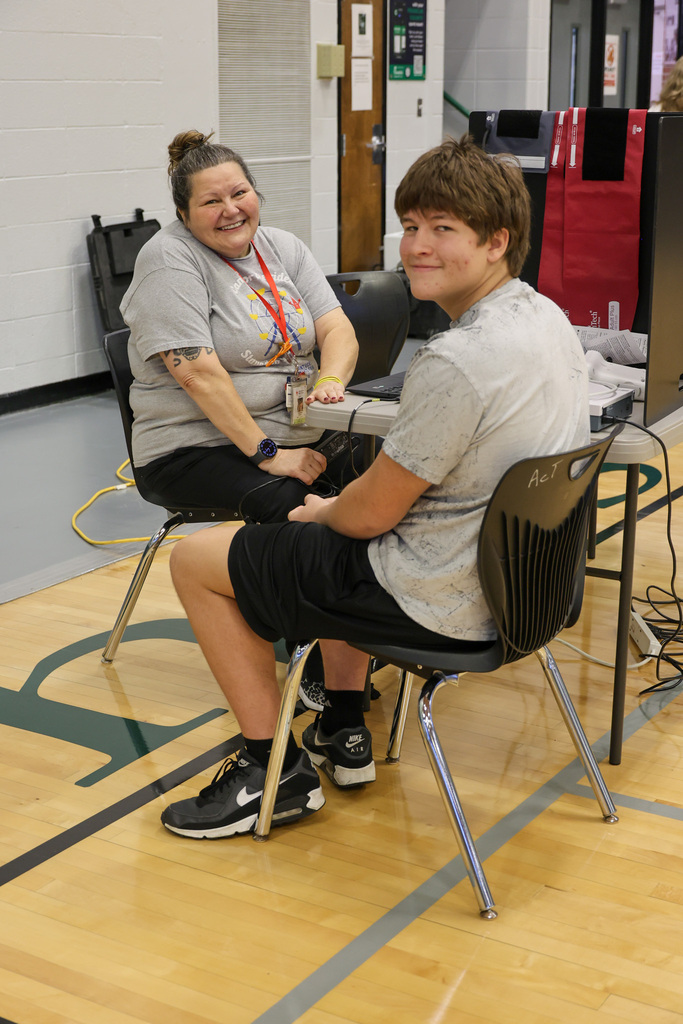 American Red Cross staff member and WHHS student smile as he prepares to check-in for his blood donation appointment.
