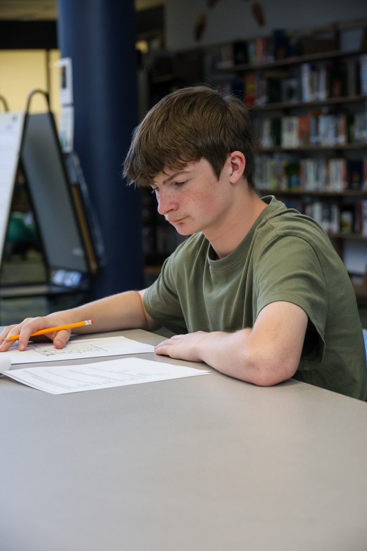 Student takes the written exam.