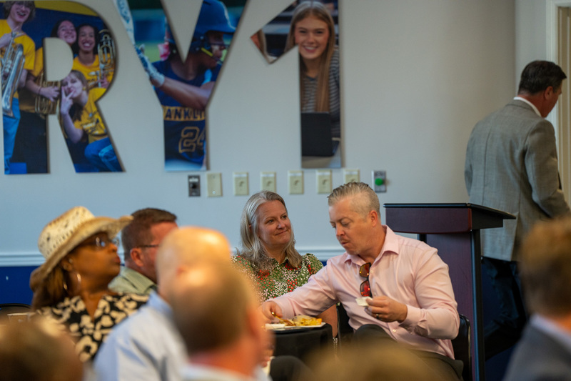 Members sitting around tables