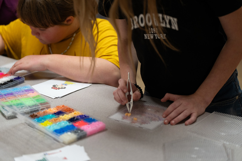 student playing with beads