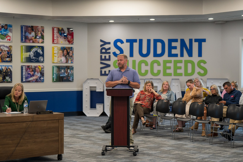 Adam Nance Principal of FFECC Delivers to the board in board room.
