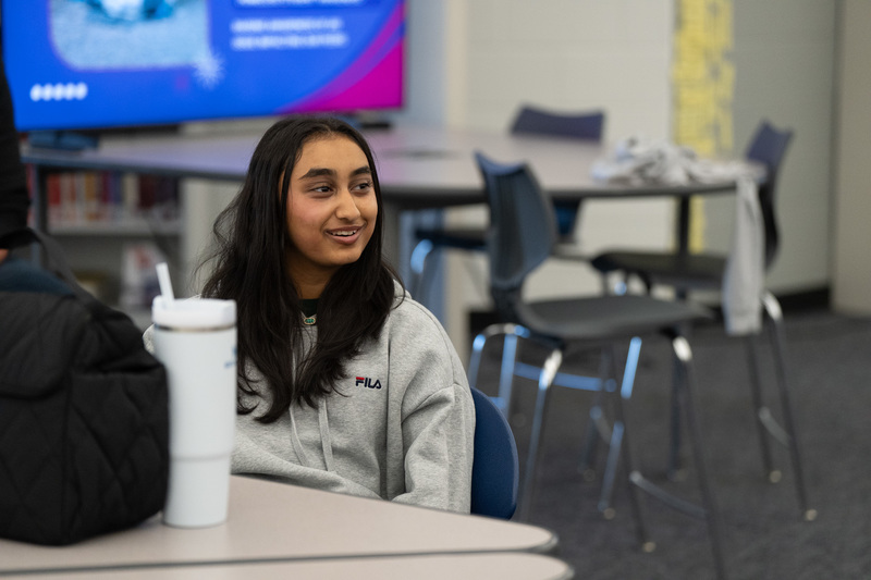 Student smiling in library