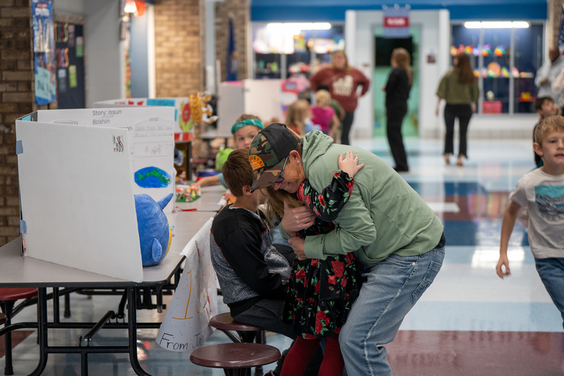 Student greets parent