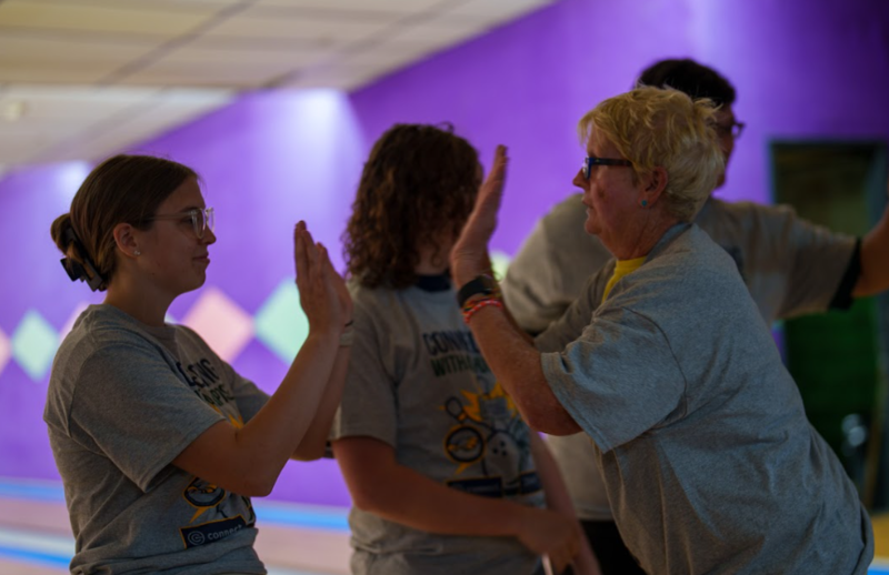 Students from FCS and Stewart Home High Five one another to hype each other up.