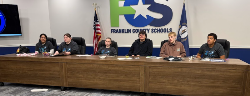 Students at the board table