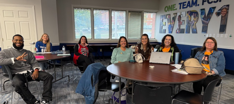 Local Leaders in board room. Trae, Keelie, Cassie, Andrea, Paisley, Tish, and Janice
