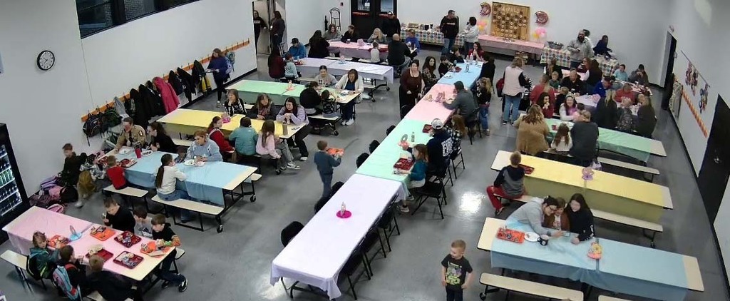 photo of group of donuts with grown ups