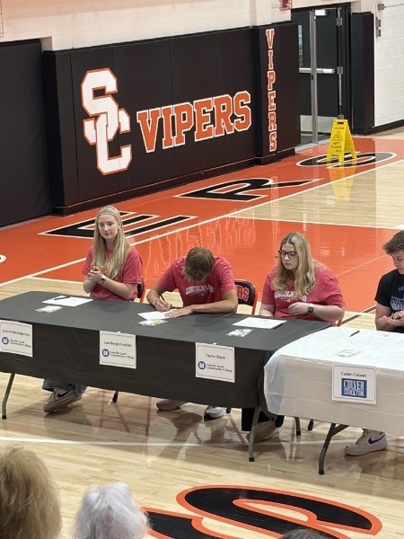 Pictures of students at senior signing day.