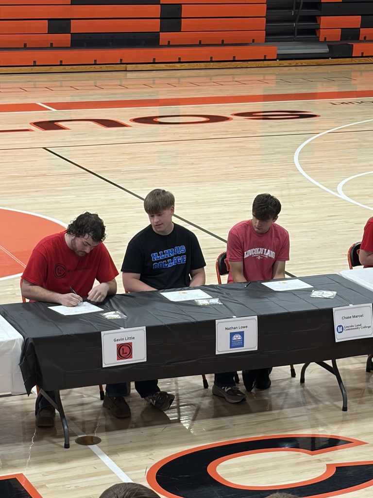 Pictures of students at senior signing day.