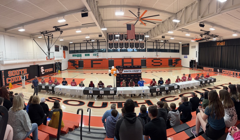 Pictures of students at senior signing day.