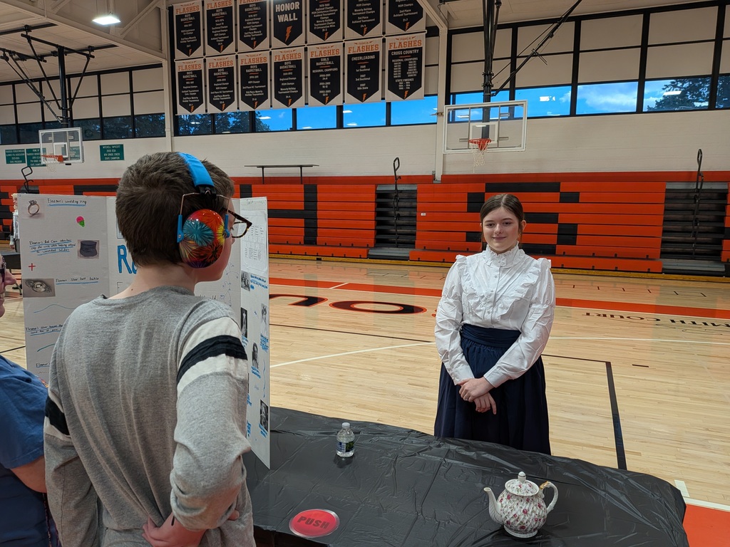 Wax museum exhibits provided by the 8th grade class. Multiple pictures taken at the event.
